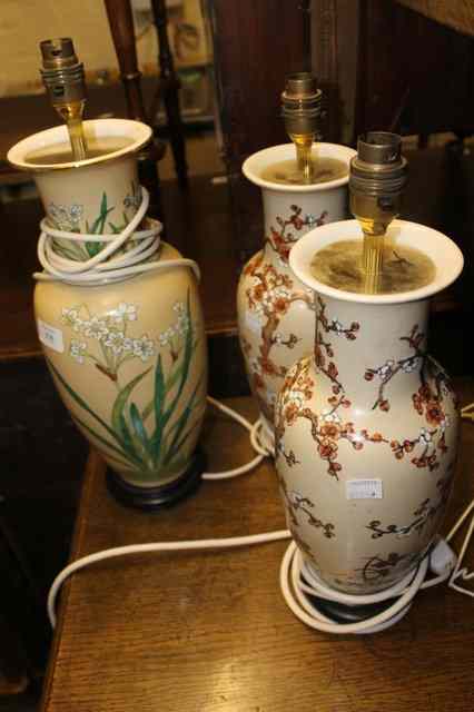 Appraisal: A PAIR OF CHINESE STYLE PORCELAIN TABLE LAMPS with shades