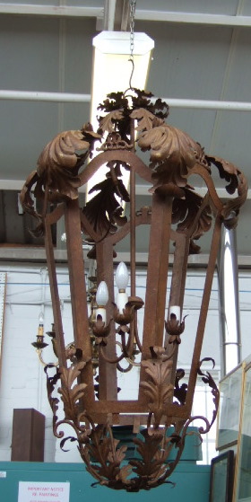 Appraisal: A modern patinated wrought iron lantern of hexagonal for mounted