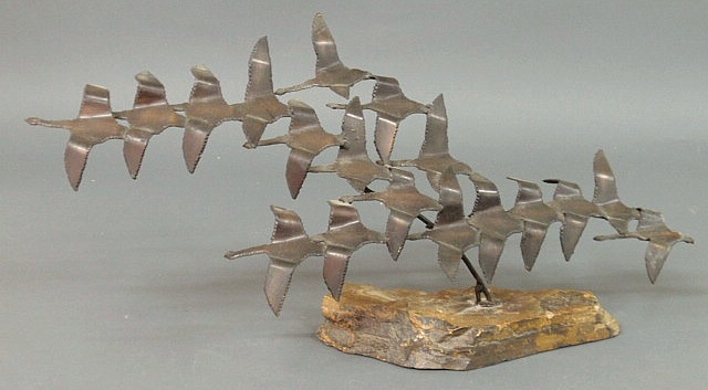 Appraisal: Metal sculpture of geese mounted on a slate base h