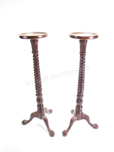 Appraisal: A pair of period-style mahogany candlestands rope-twist column with ball