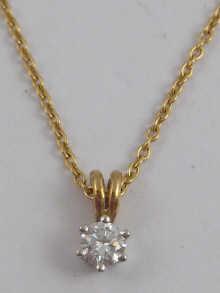 Appraisal: A yellow metal tests carat gold diamond solitaire pendant the