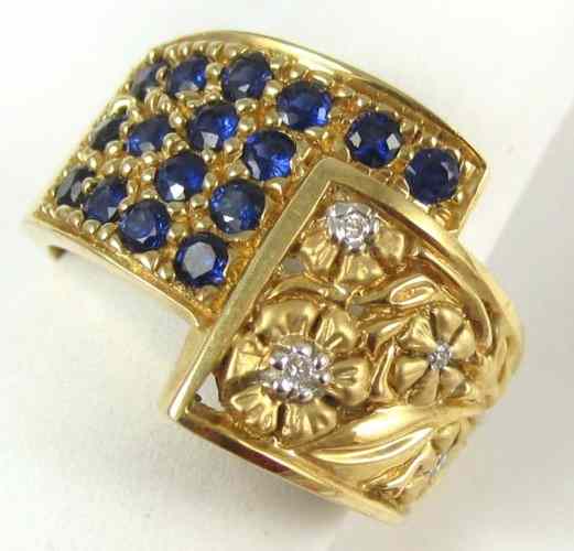 Appraisal: SAPPHIRE DIAMOND AND FOURTEEN KARAT GOLD RING set with round-cut