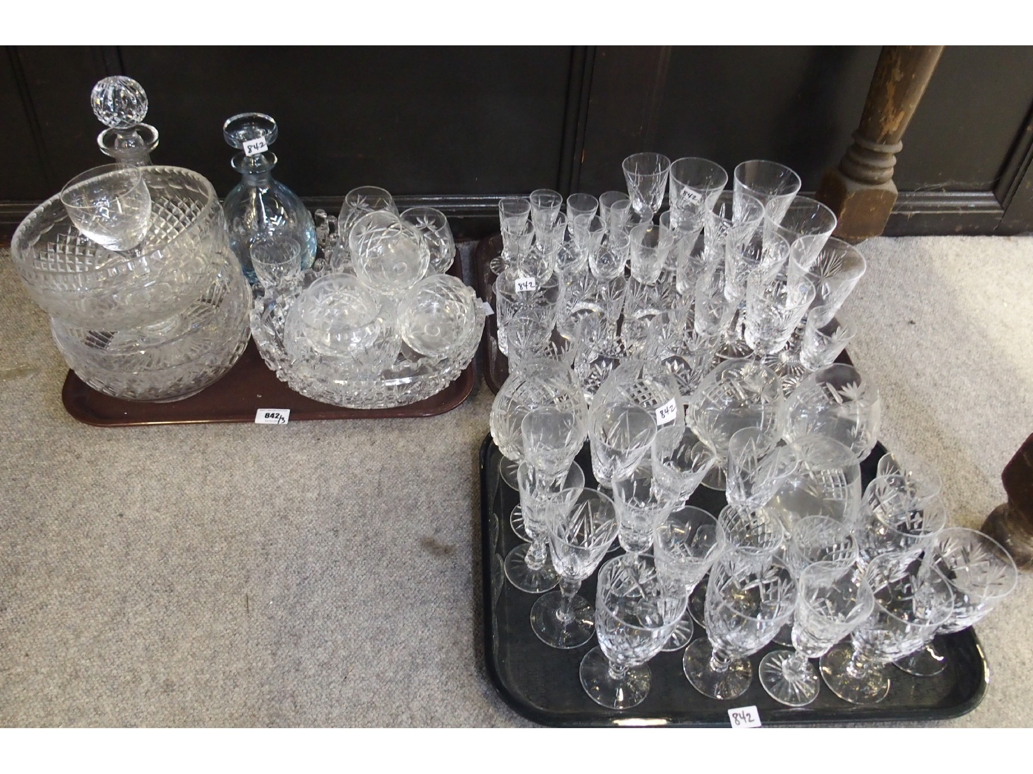 Appraisal: Three trays of cut glass including decanters wine stems centrebowls