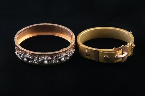 Appraisal: TWO VINTAGE HINGED OVAL BANGLE BRACELETS One late th century