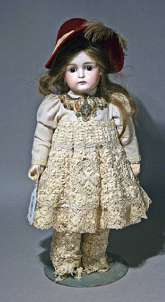 Appraisal: A German bisque-head doll unmarked with cork pate brown wig