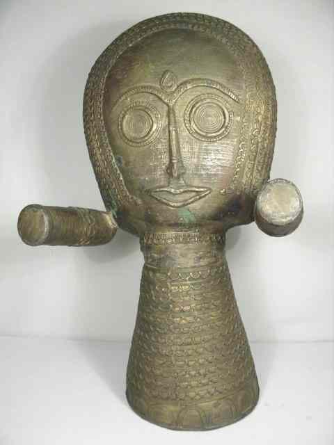 Appraisal: Southeast Asia brass tribal head sculpture Possibly a wall hanging