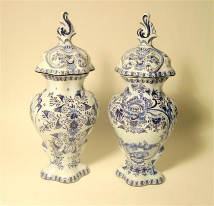 Appraisal: Pair of Delft blue and white covered urns th century