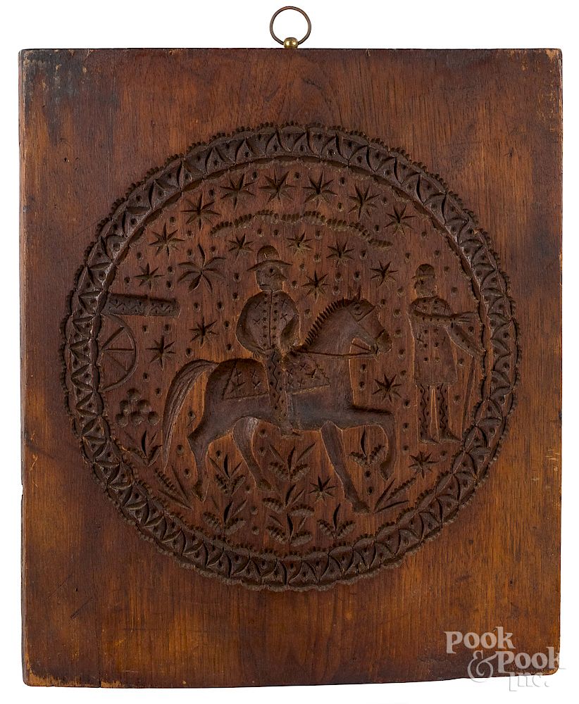 Appraisal: Carved walnut cakeboard Carved walnut cakeboard th c decorated with