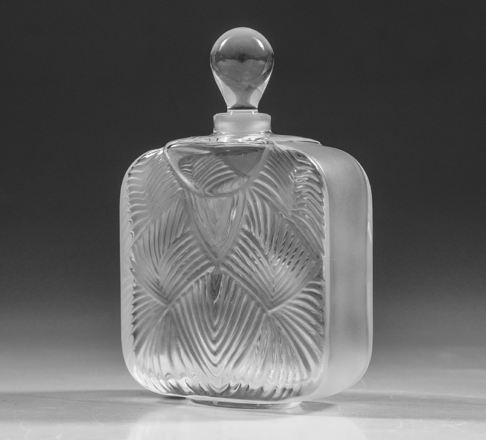 Appraisal: LALIQUE CRYSTAL PERFUME IN ORIGINAL BOX Diminutive bottle with ribbed