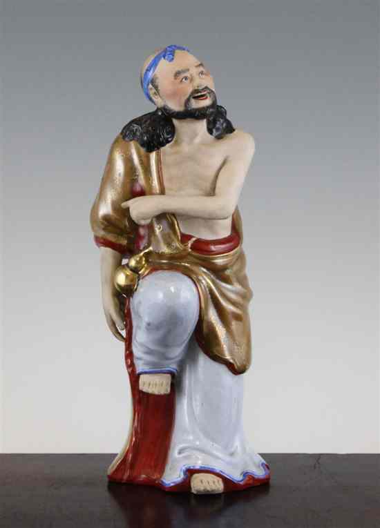 Appraisal: A Chinese enamelled and biscuit porcelain figure of Li Tieguai