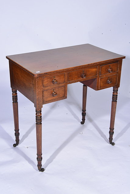 Appraisal: A TH CENTURY MAHOGANY SMALL WRITING TABLE fitted five drawers