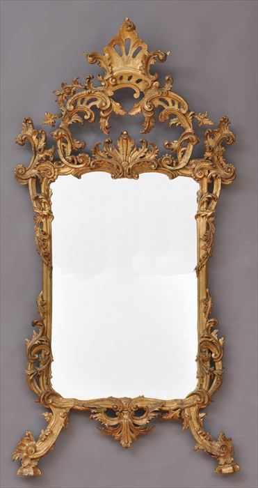 Appraisal: CHIPPENDALE-STYLE CARVED GILTWOOD MIRROR The plate within border entwined with