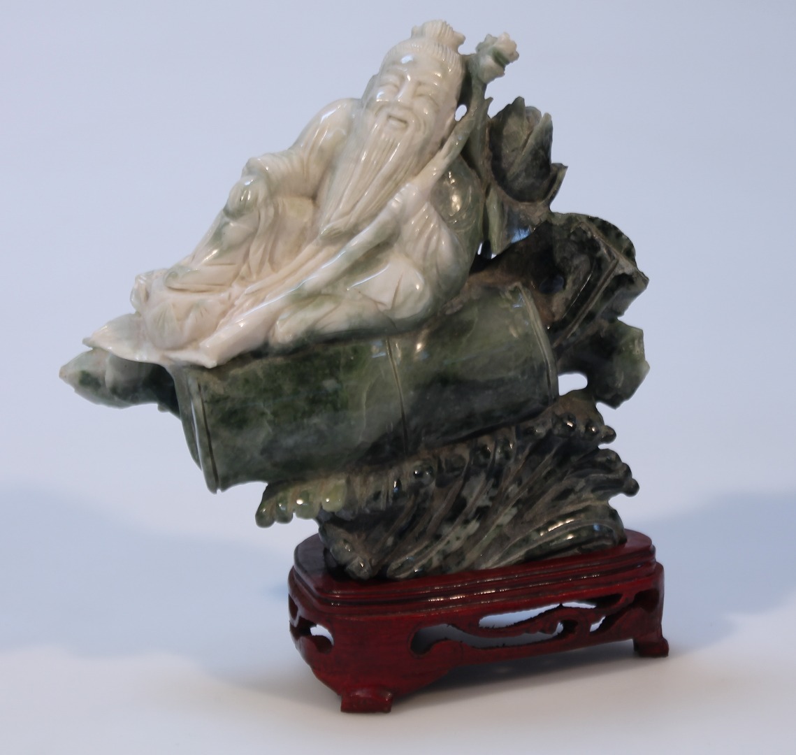 Appraisal: A thC polished jadeite style figure of a sage on