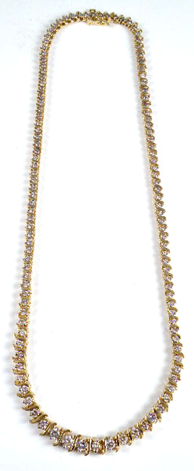 Appraisal: DIAMOND AND FOURTEEN KARAT GOLD LINE NECKLACE with S-form links