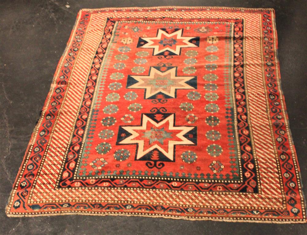 Appraisal: TRIBAL THREE STAR MEDALLION RUG triple star medallion on red