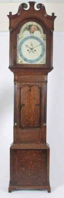 Appraisal: An oak and mahogany longcase clock with swan neck pediment