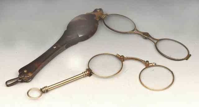 Appraisal: A GEORGIAN TORTOISESHELL LORGNETTE with inset yellow metal panel together