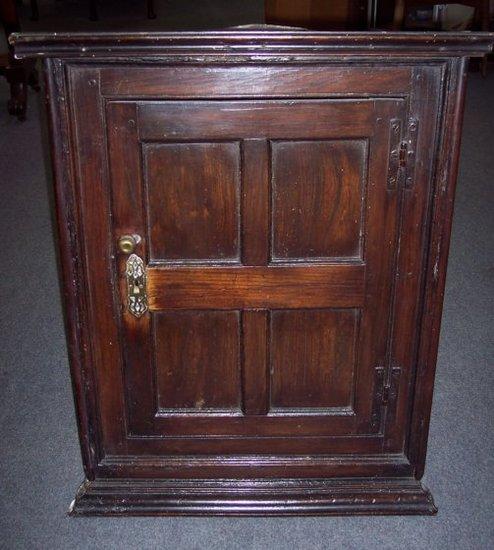 Appraisal: A small th Century oak hanging corner cupboard with four