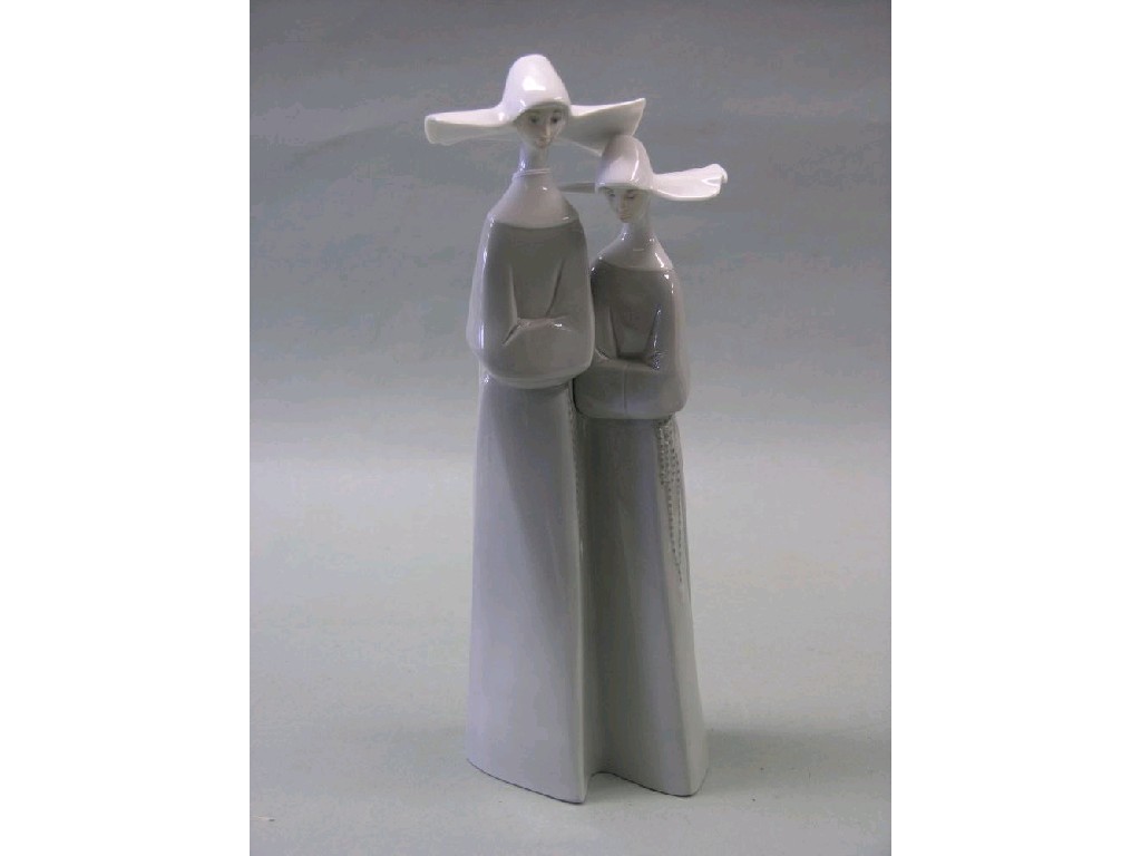 Appraisal: A Lladro figure group two nuns each wearing habit with