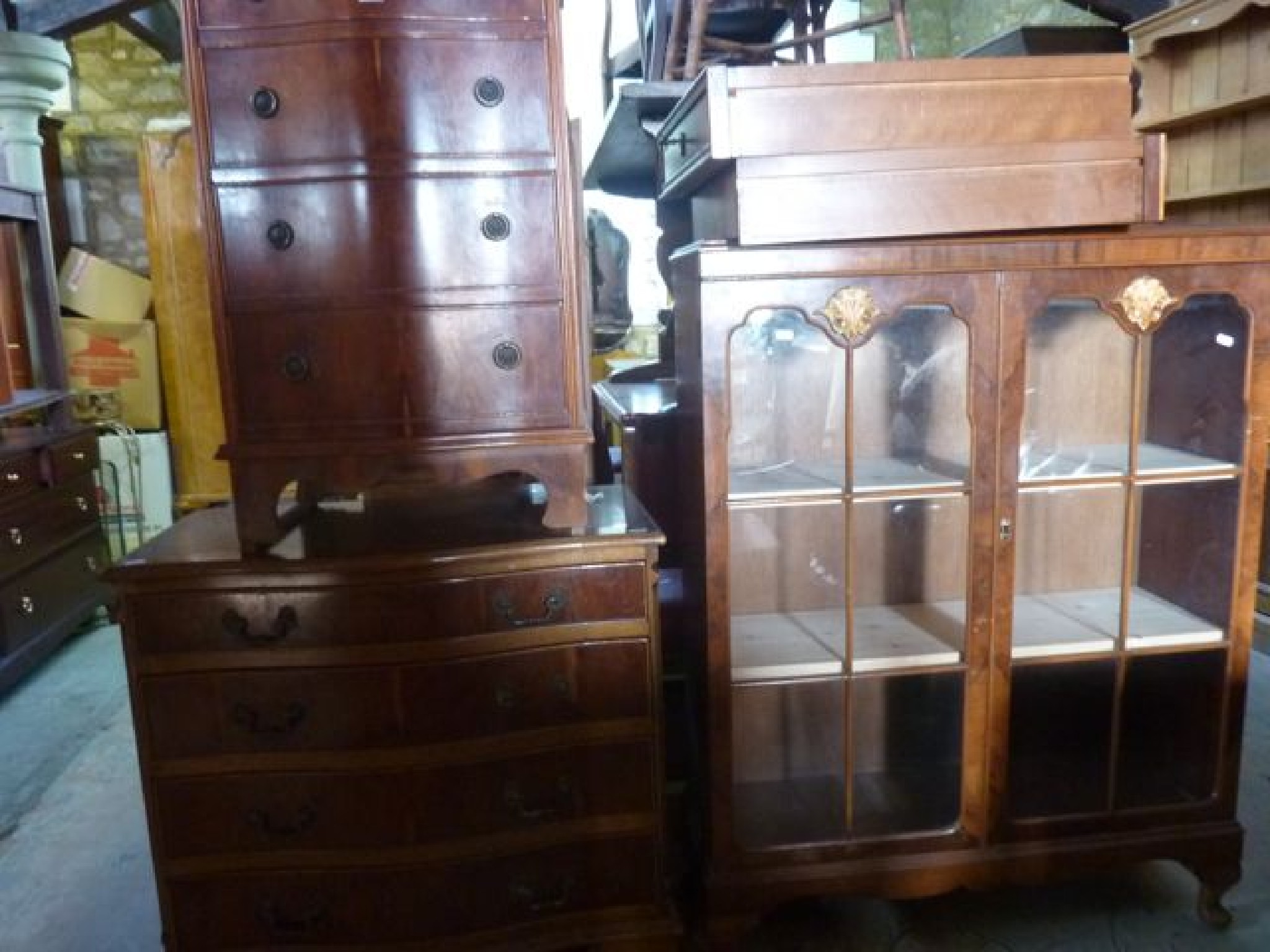 Appraisal: A reproduction yew wood veneered serpentine front bedroom chest of