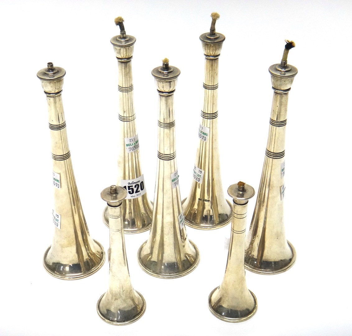 Appraisal: A set of five silver table lighters Sheffield by Walker