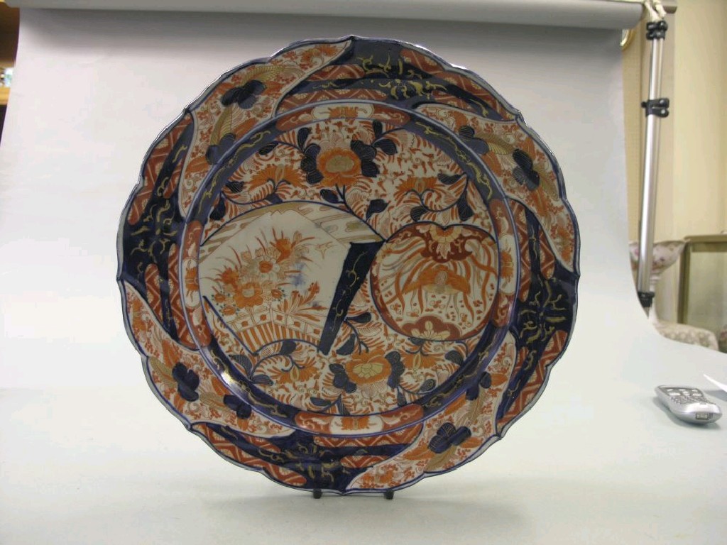 Appraisal: A th century Imari wall plate with cusped rim richly