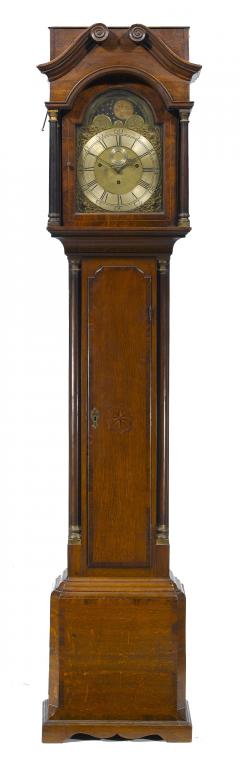 Appraisal: A GEORGE III OAK LONGCASE CLOCK the brass break-arched dial