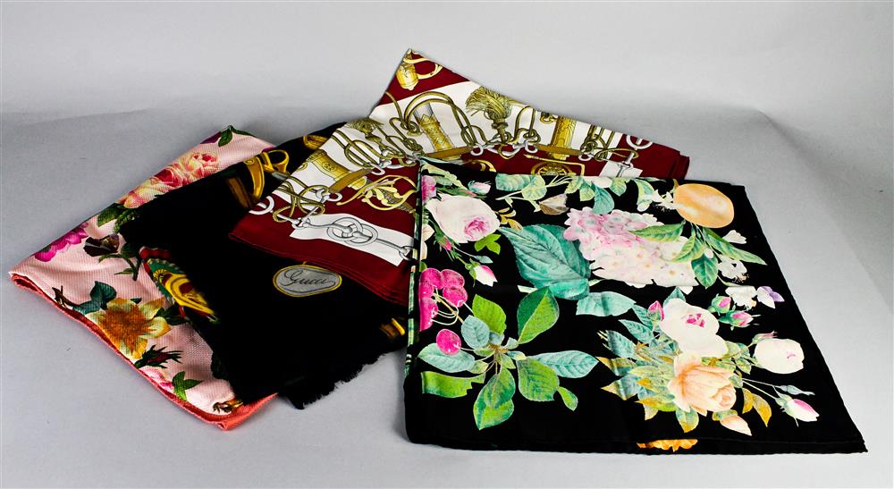 Appraisal: THREE GUCCI SCARVES the first of silk printed with various