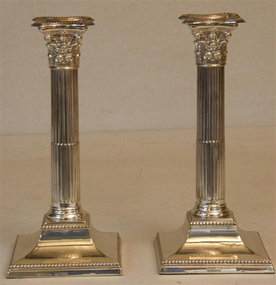 Appraisal: Pair of silver plated Corinthian column candlesticks h in