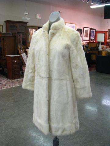 Appraisal: Two vintage fur coats including a gray fur coat no