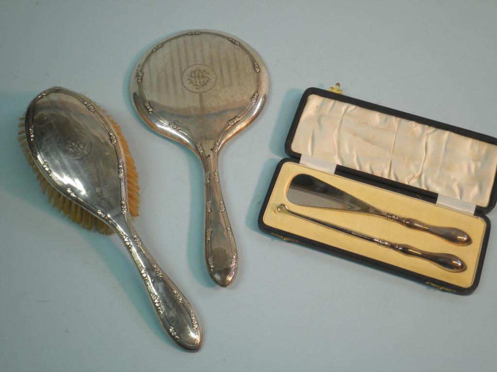 Appraisal: A silver mounted hand mirror bearing the monogram MS and