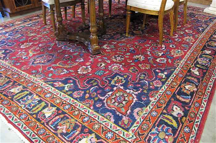 Appraisal: HAND KNOTTED PERSIAN CARPET floral and central floral medallion design