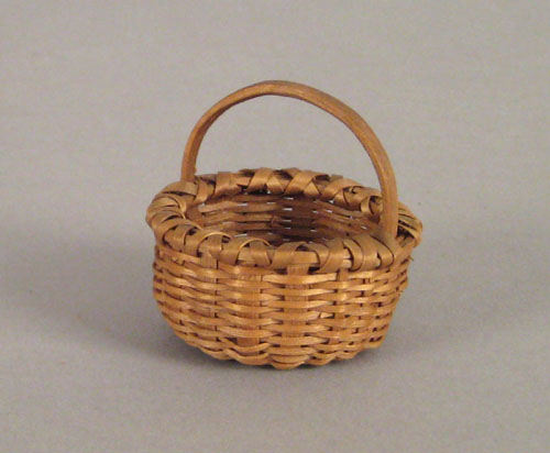 Appraisal: Miniature splint oak gathering basket th c h dia