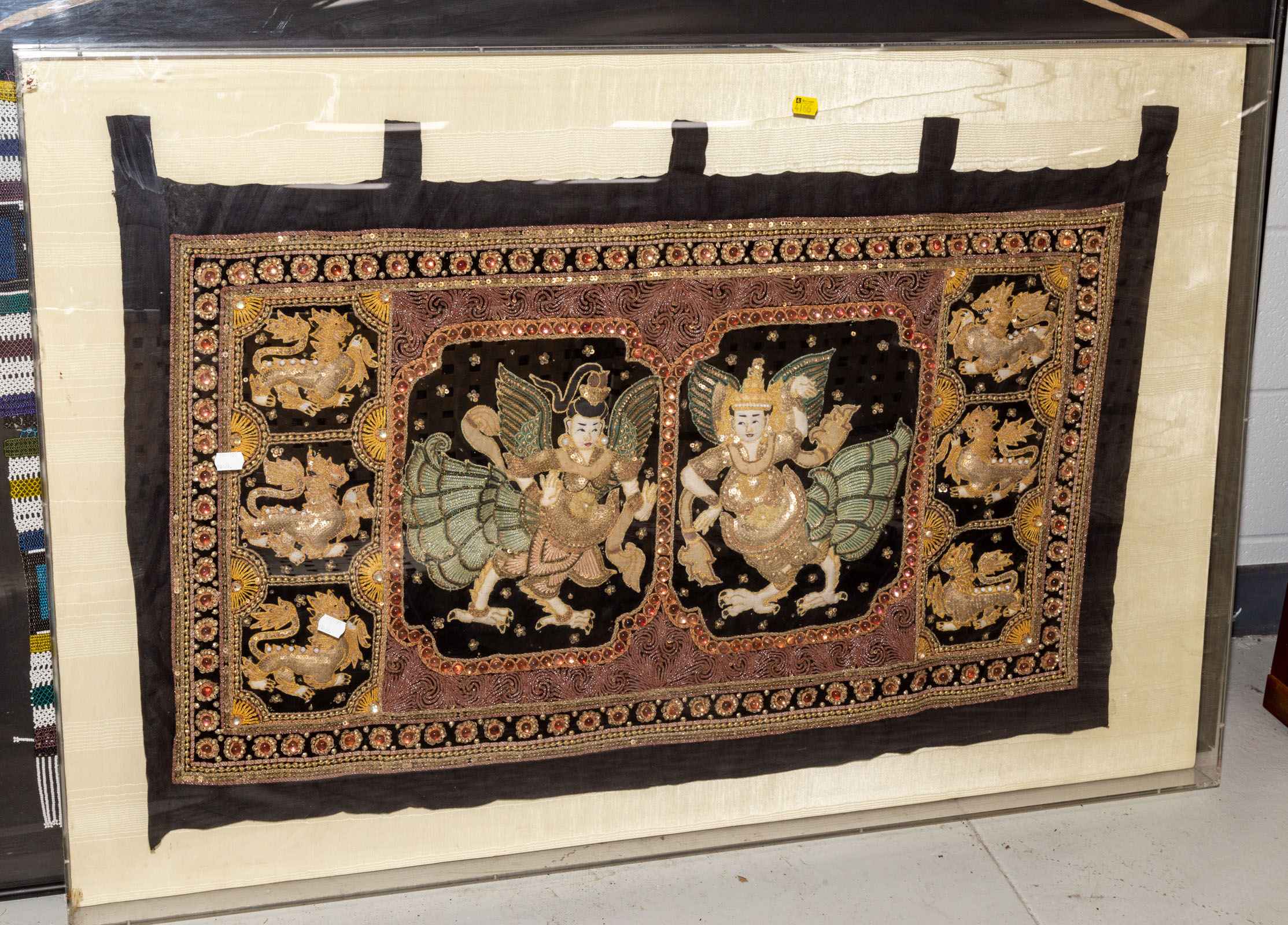 Appraisal: BURMESE STUMPWORK PANEL FRAMED th century padded embroidery embellished with