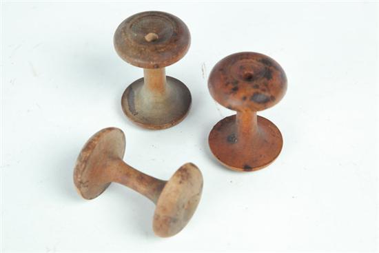 Appraisal: THREE SHAKER APPLECORE SPOOLS American th century cherry and maple