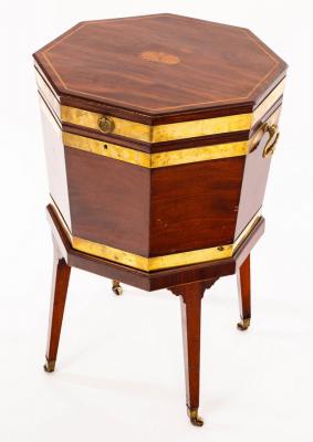 Appraisal: A George III mahogany and brass bound cellarette of octagonal