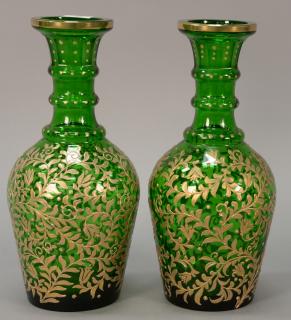 Appraisal: Pair of large green glass decanters decorated with heavy raised