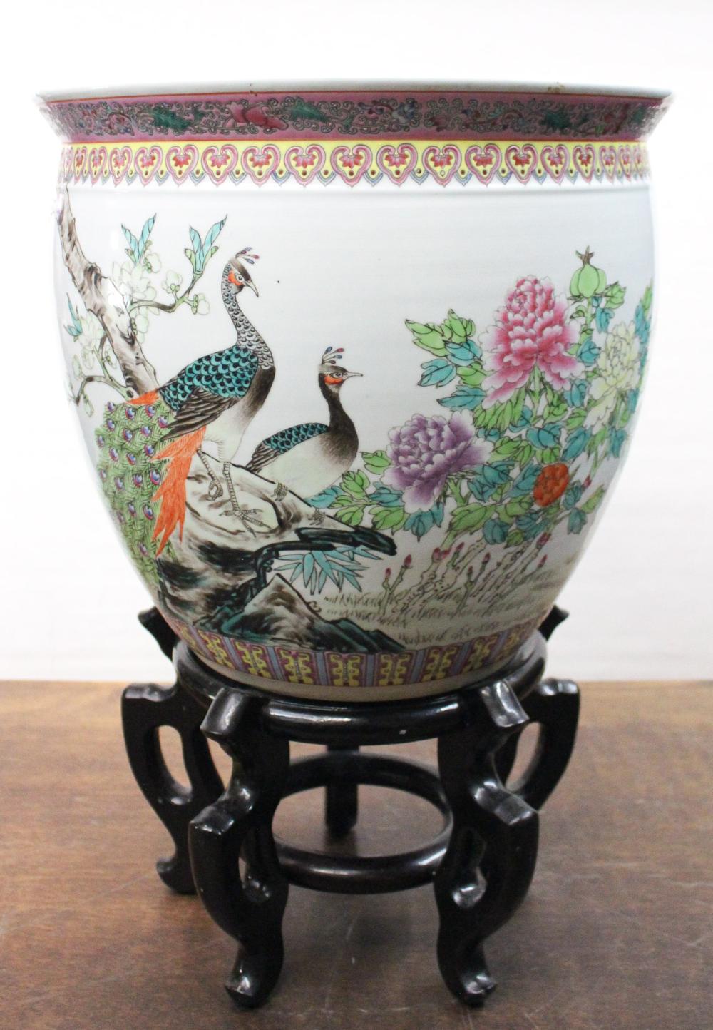 Appraisal: CHINESE FAMILLE ROSE PORCELAIN FISHBOWL ON STAND The exterior of