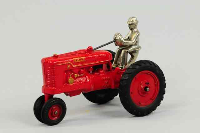 Appraisal: FARMALL TRACTOR Arcade cast iron painted in red overall McCormick