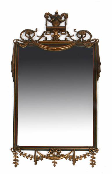 Appraisal: A Neoclassical style carved giltwood and ebonized wall mirror losses