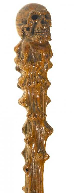 Appraisal: A MACABRE VICTORIAN BRIAR WOOD WALKING CANE the pommel carved