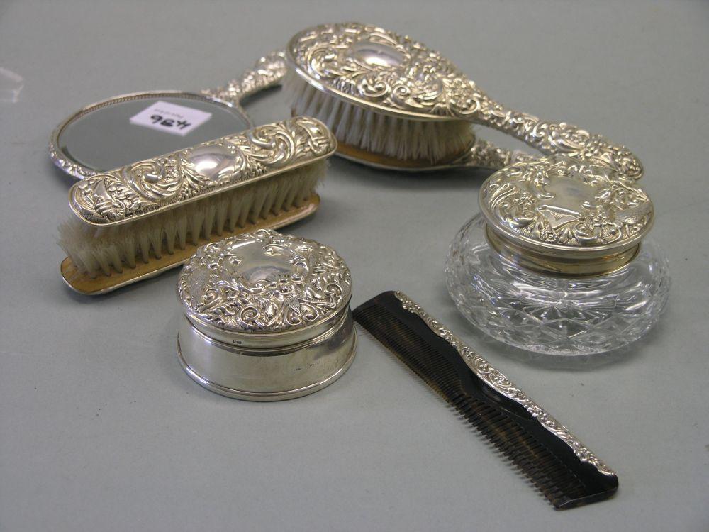 Appraisal: An embossed silver dressing table set eight pieces including pair