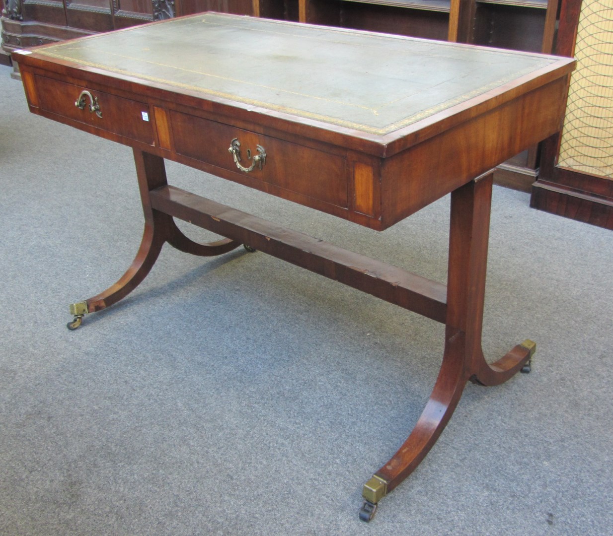 Appraisal: A th century mahogany two drawer writing table on trestle