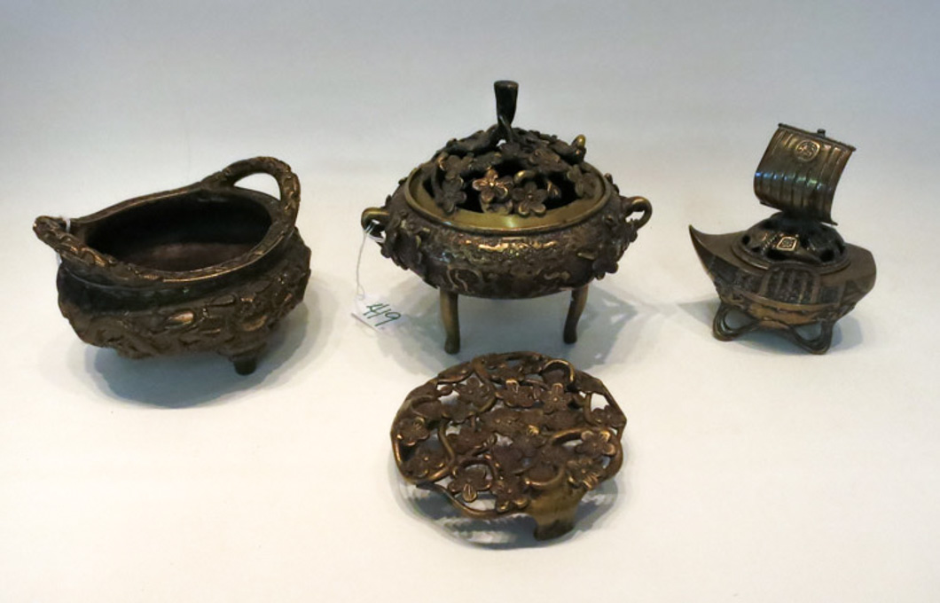 Appraisal: THREE BRASS CENSORS a tri-footed lidded censor with floral motif