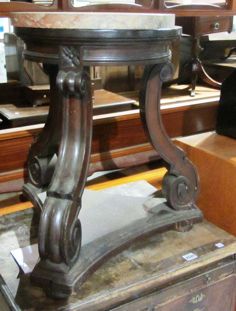 Appraisal: A th century mahogany stand with red marble top