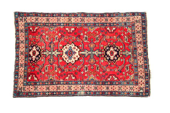 Appraisal: ORIENTAL RUG Mid- th century Caucasian Red field with a