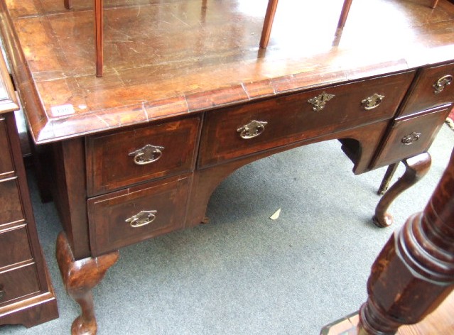 Appraisal: An th century and later mahogany and walnut kneehole dressing