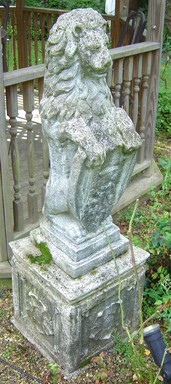 Appraisal: Pair of composition garden statues of lions resting on their