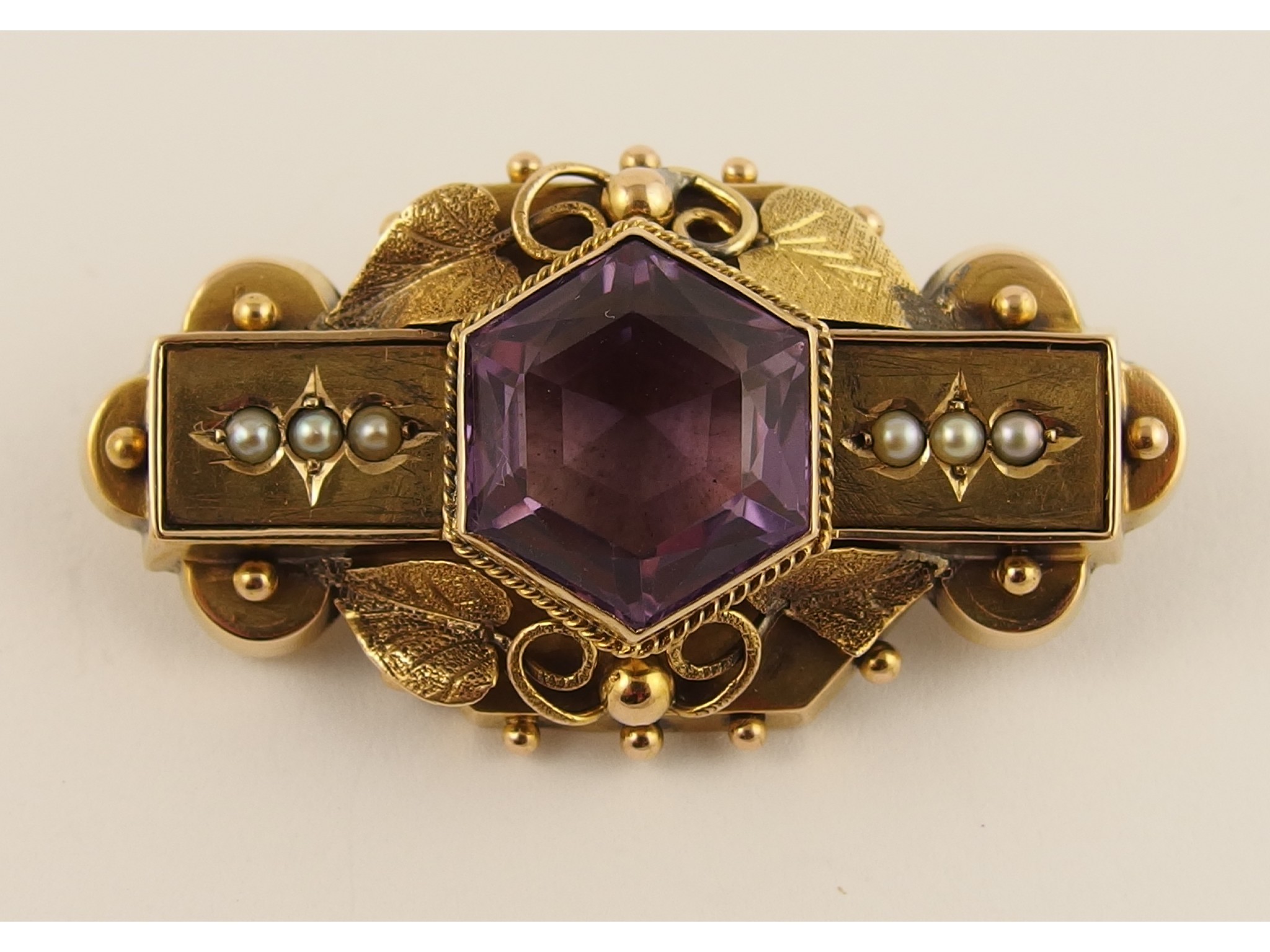 Appraisal: A yellow metal locket back brooch set with a hexagonal