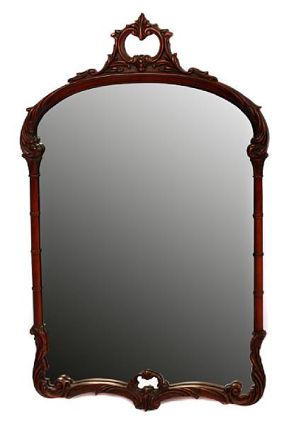 Appraisal: A Rococo style carved hardwood mirror height in width in